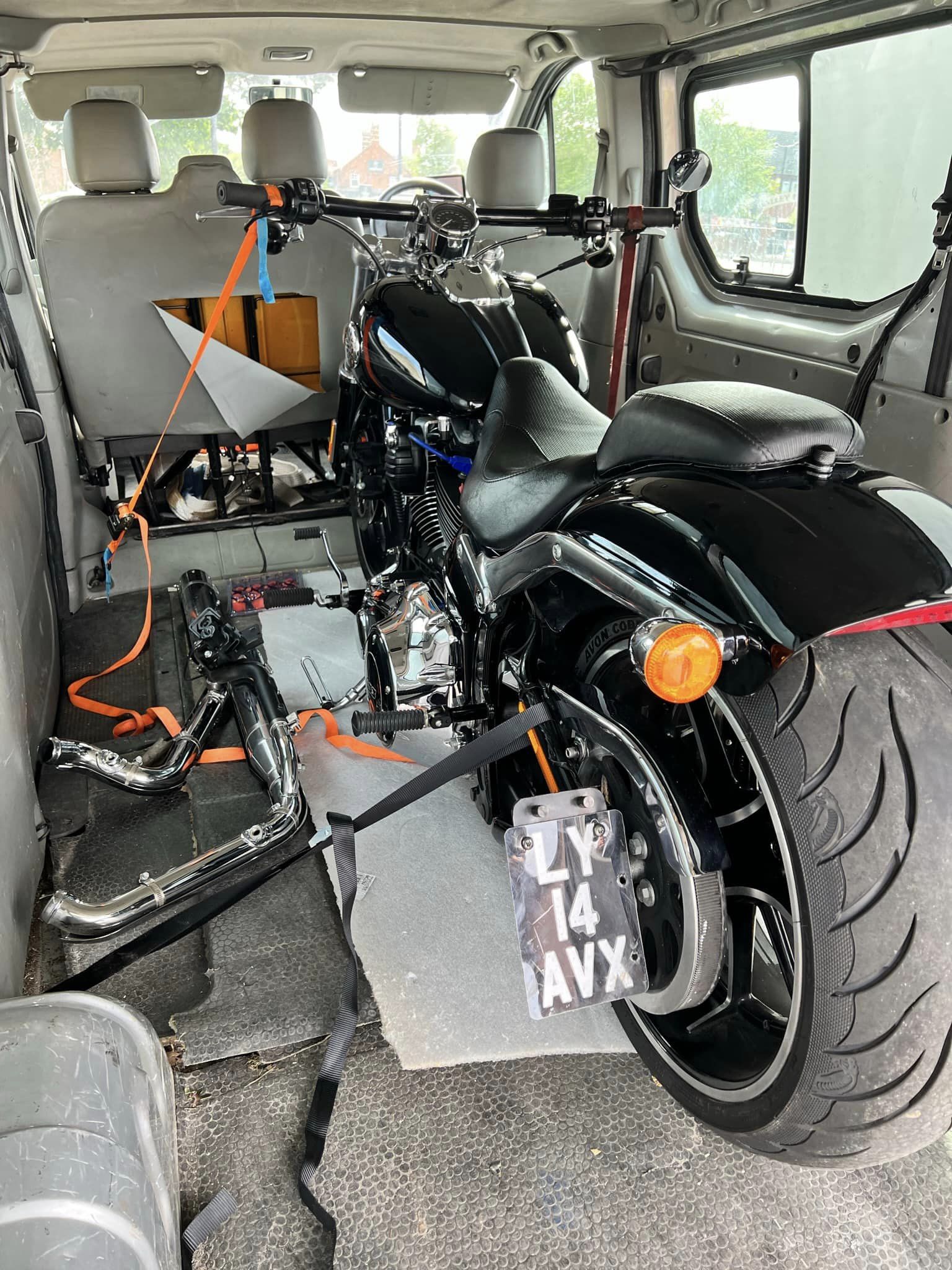 Motor bike loaded in back on van